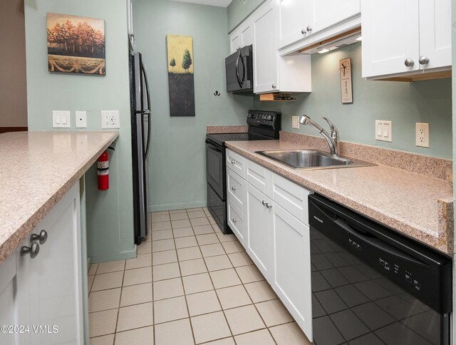 kitchen featuring white cabinetry, sink, and black appliances