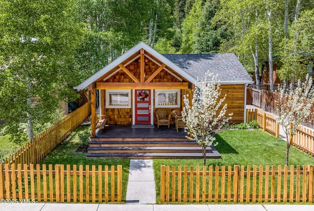 473 Pine St, Minturn, CO 81645 - view of front of house with a fenced backyard and a shingled roof