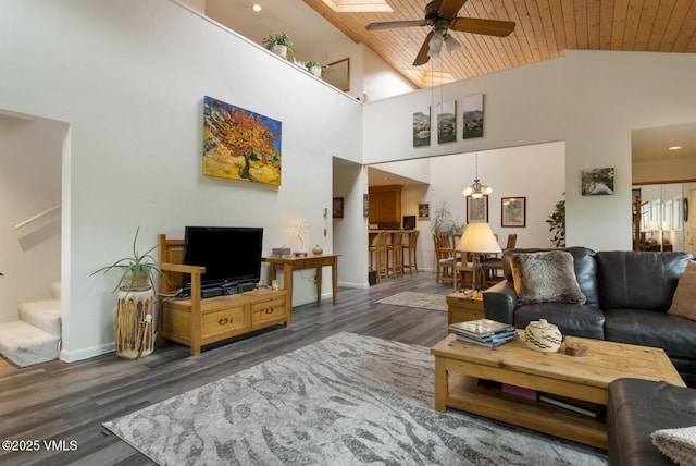 living area featuring ceiling fan, stairs, wood finished floors, high vaulted ceiling, and wooden ceiling