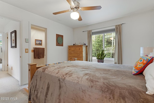 carpeted bedroom with a ceiling fan and baseboards
