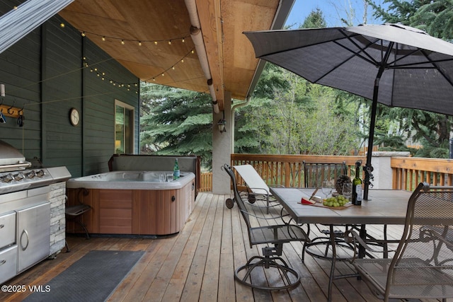 wooden deck featuring outdoor dining area and a hot tub