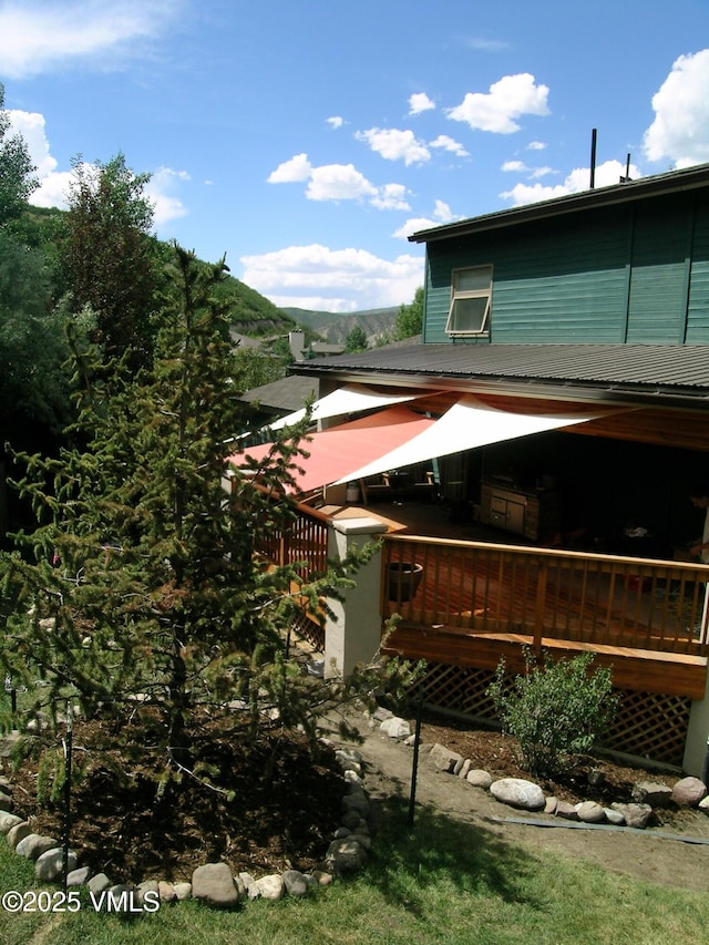 view of side of home featuring a deck