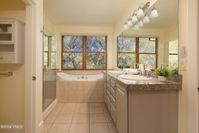 bathroom featuring vanity, tile patterned floors, and plus walk in shower