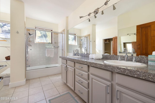 bathroom with vanity, tile patterned floors, and shower / bath combination with glass door