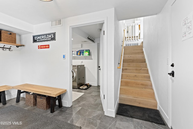 1151 Casolar Del Norte Dr Unit A, Vail, CO 81657 - mudroom with washing machine and clothes dryer and baseboards