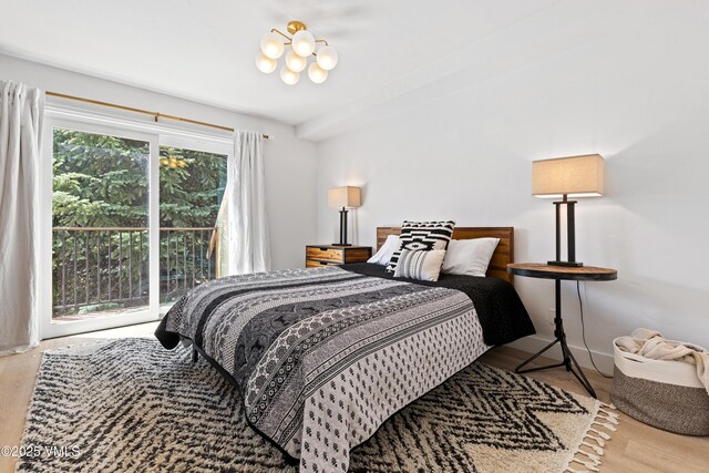 1151 Casolar Del Norte Dr Unit A, Vail, CO 81657 - bedroom with access to outside and wood finished floors