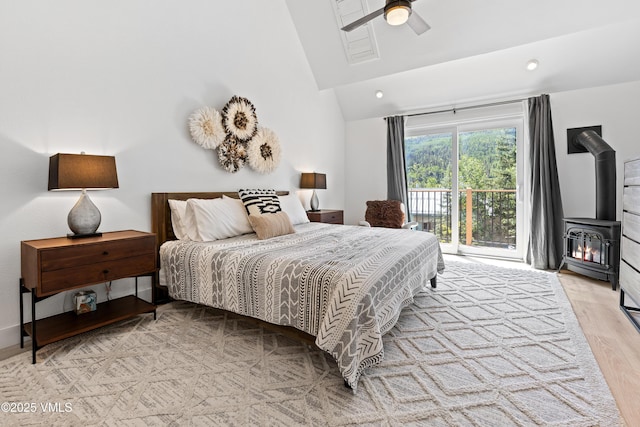1151 Casolar Del Norte Dr Unit A, Vail, CO 81657 - bedroom featuring access to exterior, a wood stove, wood finished floors, a ceiling fan, and recessed lighting
