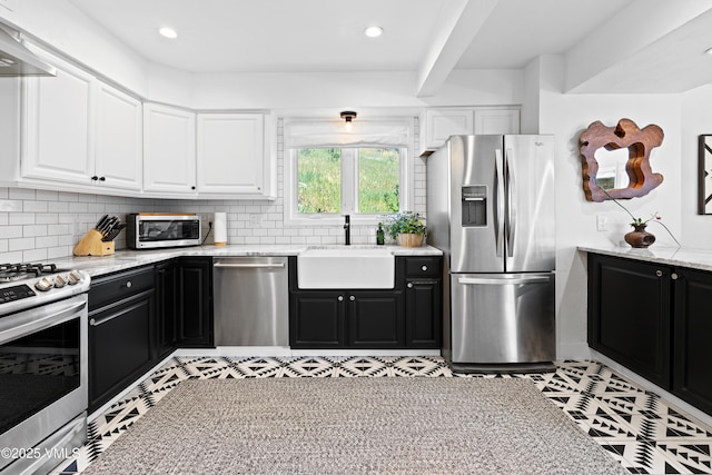 1151 Casolar Del Norte Dr Unit A, Vail, CO 81657 - kitchen featuring appliances with stainless steel finishes, dark cabinetry, white cabinetry, premium range hood, and recessed lighting