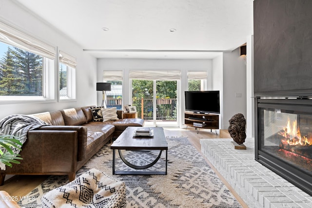 1151 Casolar Del Norte Dr Unit A, Vail, CO 81657 - living area with wood finished floors and a brick fireplace