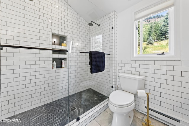 1151 Casolar Del Norte Dr Unit A, Vail, CO 81657 - full bathroom with a stall shower, baseboard heating, lofted ceiling, tile patterned floors, and tile walls