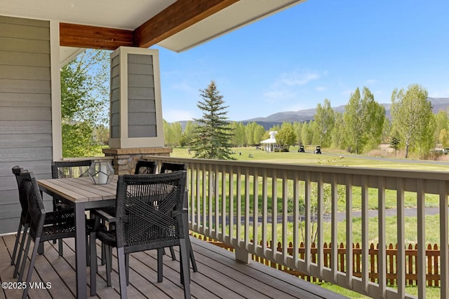 207 Aidan Rd, Eagle, CO 81631 - wooden deck with outdoor dining space and a mountain view