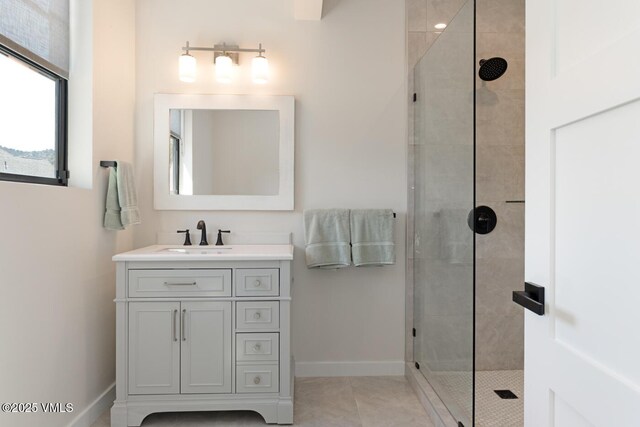 207 Aidan Rd, Eagle, CO 81631 - full bathroom featuring a tile shower, baseboards, vanity, and tile patterned flooring