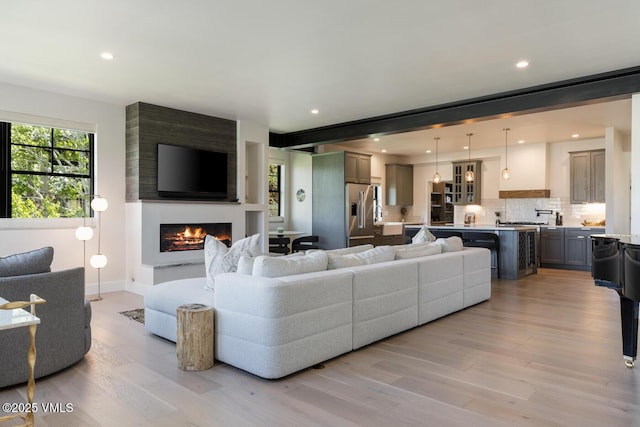 207 Aidan Rd, Eagle, CO 81631 - living area featuring a fireplace, light wood finished floors, recessed lighting, and baseboards
