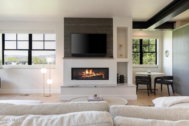 207 Aidan Rd, Eagle, CO 81631 - living area with wood finished floors, baseboards, and a large fireplace