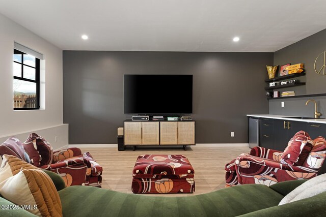 207 Aidan Rd, Eagle, CO 81631 - living room with light wood-style flooring, recessed lighting, baseboards, and bar