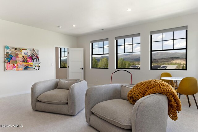 207 Aidan Rd, Eagle, CO 81631 - living area with light carpet, baseboards, and recessed lighting