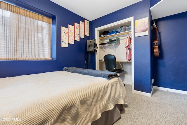 bedroom featuring a closet, carpet, and baseboards