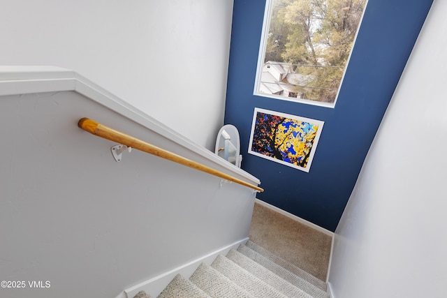 staircase with carpet and baseboards