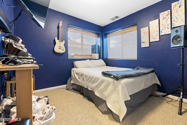 carpeted bedroom with baseboards