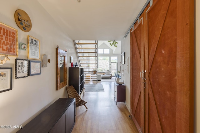 705 Nogal Rd Unit C9, Eagle, CO 81631 - hall featuring light wood-style flooring and high vaulted ceiling