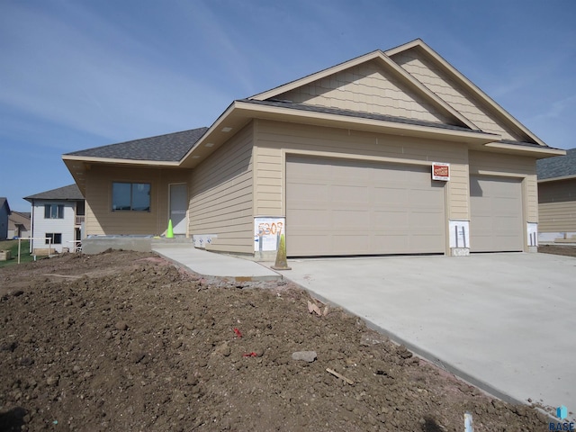 view of side of property featuring a garage