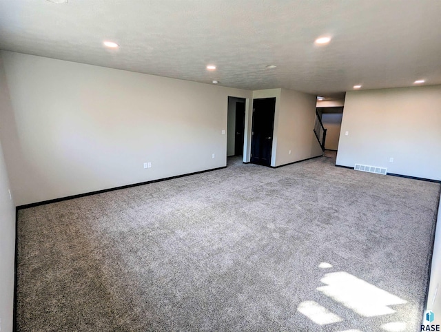 spare room with light carpet