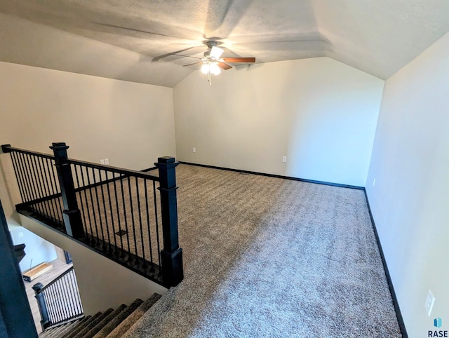 bonus room with carpet, vaulted ceiling, and ceiling fan