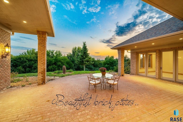 view of patio terrace at dusk