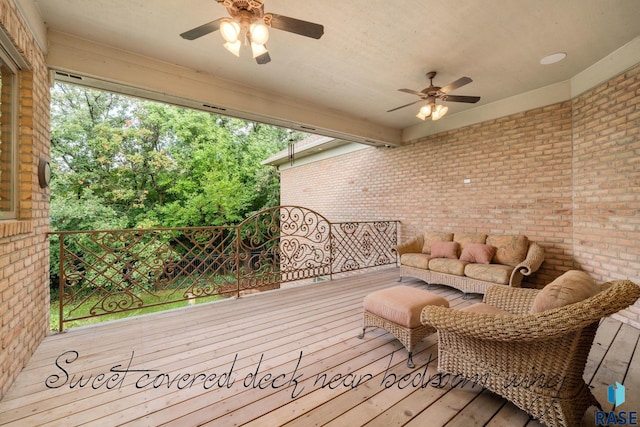 wooden terrace featuring an outdoor hangout area