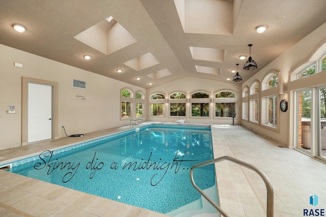 view of swimming pool with a skylight