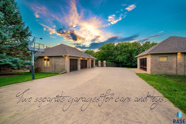 exterior space featuring a garage and a yard