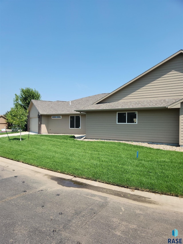 exterior space with a lawn and a garage