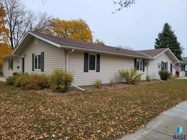 view of property exterior with a yard