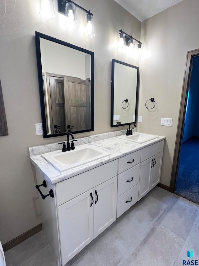 bathroom with double sink, tile flooring, and vanity with extensive cabinet space