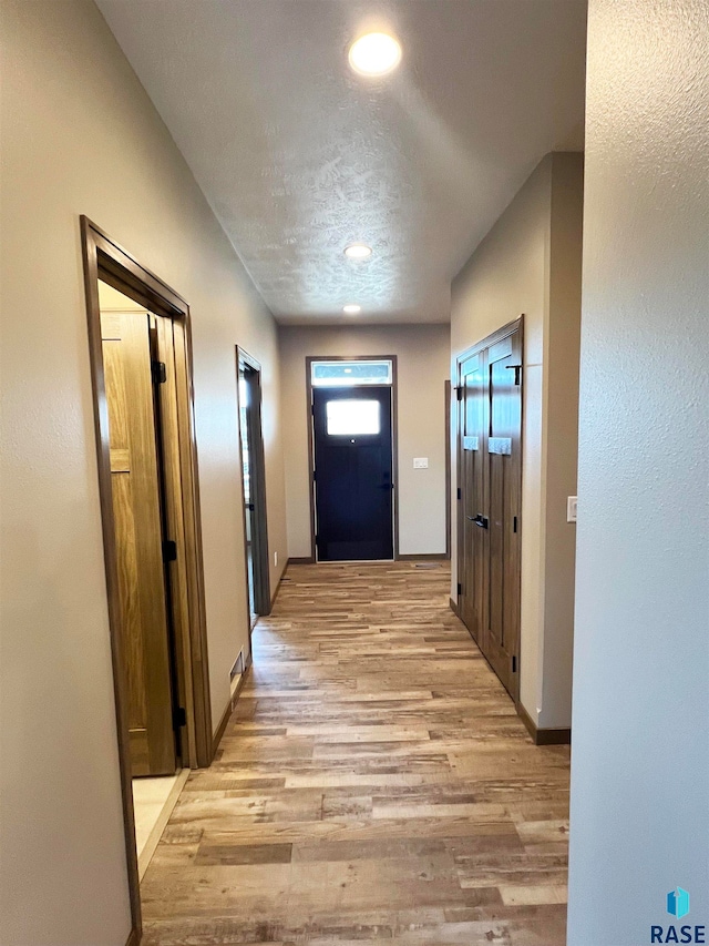 hall featuring light wood-type flooring