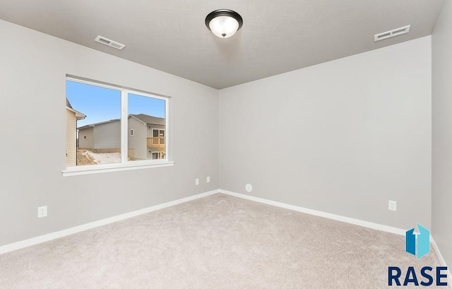 view of carpeted spare room