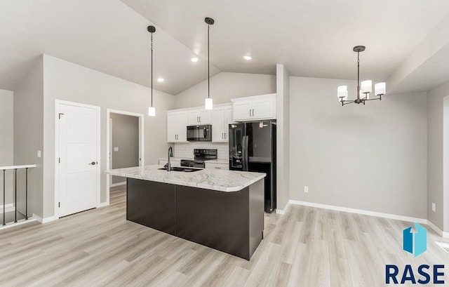 kitchen with tasteful backsplash, a kitchen island with sink, sink, black appliances, and white cabinetry