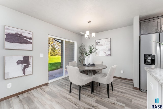 117 N Summit Ave, Tea, SD 57064 - dining space featuring a notable chandelier and light wood-type flooring
