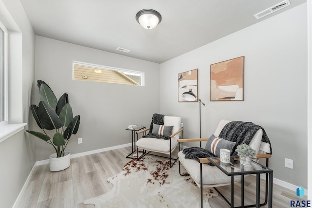 sitting room featuring light wood-type flooring