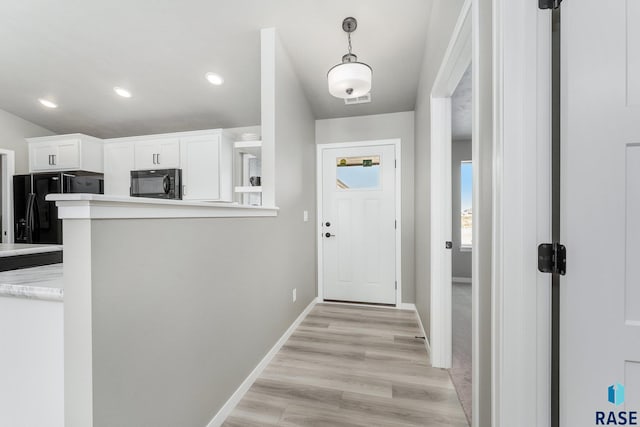 doorway to outside with light hardwood / wood-style floors