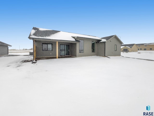 view of snow covered house