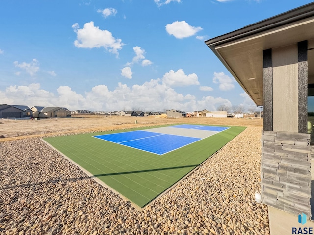 view of basketball court featuring tennis court