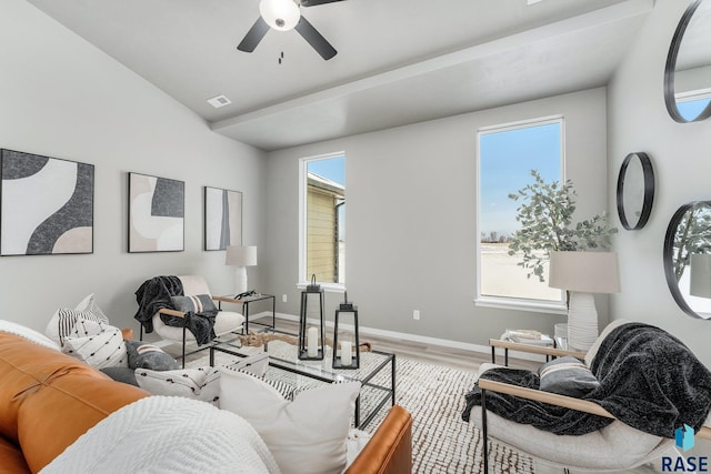 living room featuring hardwood / wood-style flooring and ceiling fan