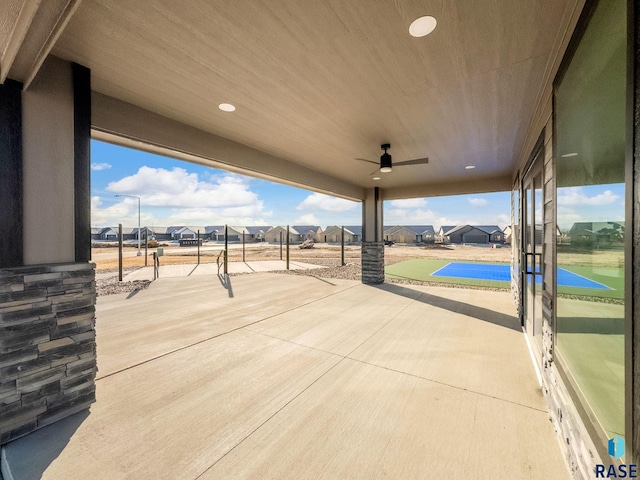 view of patio featuring ceiling fan