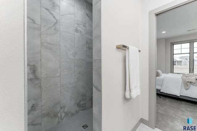 bathroom with a tile shower