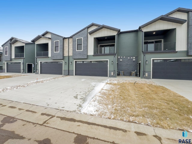 multi unit property with a balcony and a garage