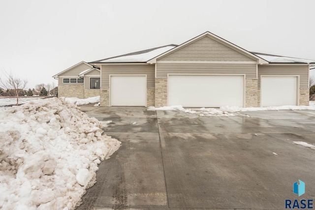 single story home featuring a garage