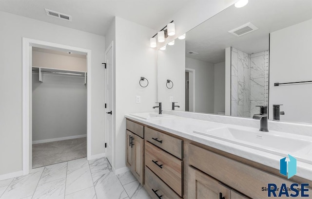 bathroom featuring vanity and a shower