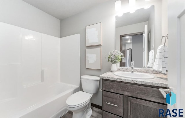 full bathroom featuring shower / tub combination, vanity, and toilet