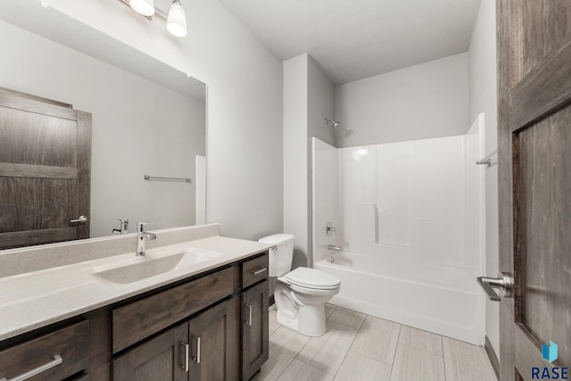 full bathroom featuring toilet, washtub / shower combination, and vanity